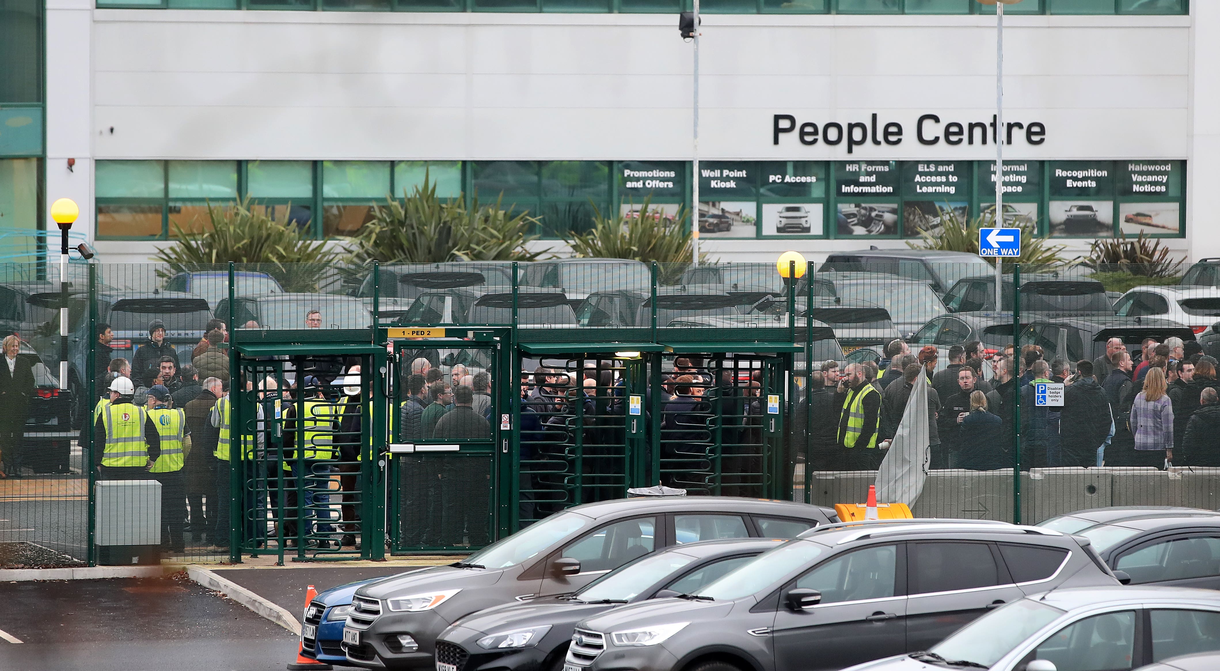 Jaguar Land Rover staff gather at work